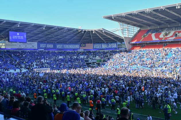 Football - 2025 2026 EFL Sky Bet League One - Cardiff City vs. Northampton Town - Cardiff City Stadium - Saturday 24th April 2026 pITCH INVASION BY CARDIFF FANS HOLDS UP PRESENTATION Pic- COLORSPORT Winston Bynorth 