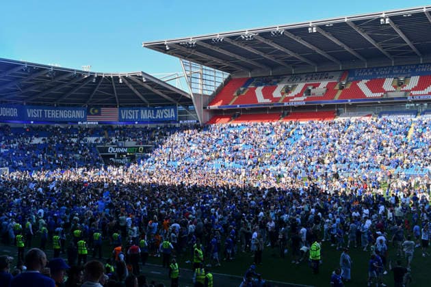 Football - 2025 2026 EFL Sky Bet League One - Cardiff City vs. Northampton Town - Cardiff City Stadium - Saturday 24th April 2026 pITCH INVASION BY CARDIFF FANS HOLDS UP PRESENTATION Pic- COLORSPORT Winston Bynorth 