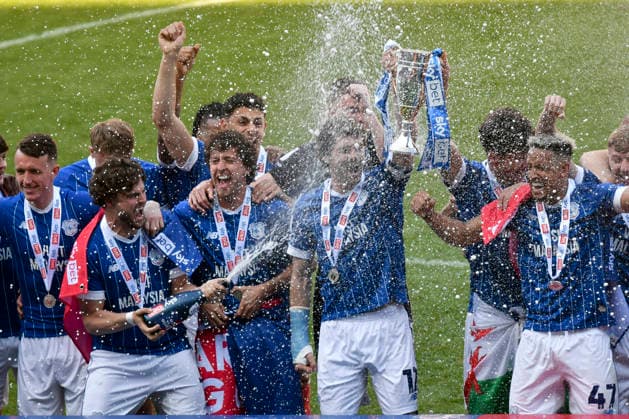 Football - 2025 2026 EFL Sky Bet League One - Cardiff City vs. Northampton Town - Cardiff City Stadium - Saturday 24th April 2026 Rubin Colwill, CAPT, CARDIFF CITY RAISES THE TROPHY AS cARDIFF CELEBRATE PROMOTION Pic- COLORSPORT Winston Bynorth 