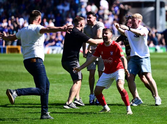 Rochdale v York City Enterprise National League York City s Ollie Pearce celebrates with York City fans after the Enterprise National League match at Crown Oil Arena, Rochdale 25 04 2026 UK Newspapers OUT Copyright: xChrisxNuttonx FIL-23349-0010
