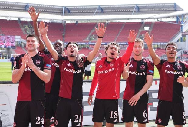 Sport Bilder des Tages 26.04.2026 - Fussball - Saison 2025 2026 - 2. Fussball - Bundesliga - 31. Spieltag: 1. FC Nürnberg FCN ( Club ) - 1. FC Magdeburg FCM - Sportfoto Zink DaMa - xdaxmax - DFL regulations prohibit any use of photographs as image sequences and or quasi-video - only for editorial use - Jubel Freude nach Spielende - Mannschaft Team des FCN feiert singt mit Clubfan Clubfans FCN-Fans Fans feiert mit Clubfan Clubfans FCN-Fans Fans - Luka Lochoshvili (24, 1. FC Nürnberg FCN ) Rabby Nzingoula (22, 1. FC Nürnberg FCN ) Berkay Yilmaz (21, 1. FC Nürnberg FCN ) Rafael Lubach (18, 1. FC Nürnberg FCN ) Adam Markhiev (6, 1. FC Nürnberg FCN ) Henri Koudossou (8, 1. FC Nürnberg FCN ) *** 26 04 2026 Soccer Season 2025 2026 2 Soccer Bundesliga 31 Matchday 1 FC Nürnberg FCN Club 1 FC Magdeburg FCM Sportfoto Zink DaMa xdaxmax DFL regulations prohibit any use of photographs as image sequences and or quasi video only for editorial use Jubel Freude nach Spielende Mannschaft Team des FCN feiert singt mit Clubfan Clubfans FCN Fans Fans Fans celebrates with Clubfan Clubfans FCN Fans Fans Luka Lochoshvili 24, 1 FC Nürnberg FCN Rabby Nzingoula 22, 1 FC Nürnberg FCN Berkay Yilmaz 21, 1 FC Nürnberg FCN Rafael Lubach 18, 1 FC Nürnberg FCN Adam Markhiev 6, 1 FC Nürnberg FCN Henri Koudossou 8, 1 FC Nürnberg FCN