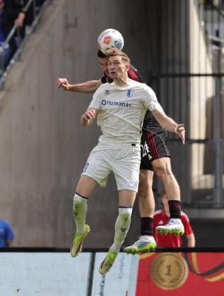 26 04 2026 Soccer Season 2025 2026 2 Soccer Bundesliga 31 Matchday 1 FC Nuremberg FCN Club 1 FC Magdeburg FCM Sportfoto Zink DaMa xdaxmax DFL regulations prohibit any use of photographs as image sequences and or quasi video only for editorial use Maximilian Breunig 9, 1 FC Magdeburg FCM in header duel with Luka Lochoshvili 24, 1 FC Nuremberg FCN