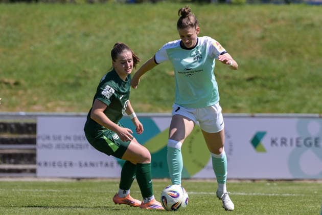 26 04 2026, Soccer, 2 Womens Bundesliga, 2025 2026, Matchday 23, SG 99 Andernach VfL Wolfsburg II Carolin Schraa 7 Andernach with the ball on the foot Joelle Steiner Wolfsburg comes too late Andernach Stadium Rhineland-Palatinate Germany