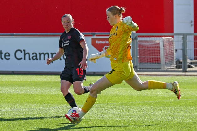 26 04 2026, xsscx, Women Soccer, Bayer 04 Leverkusen SC Freiburg, 1 Soccer Bundesliga, 23 Matchday, Ulrich Haberland Stadium, Season 2025 2026 Vanessa Haim Bayer Leverkusen 13 in duel against Rebecca Adamczyk SC Freiburg 33 DFB regulations prohibit any use of photographs as image sequences and or quasi video Photo xSandraxScherningxPressefotoKochx Nordrhein Westfalen Germany