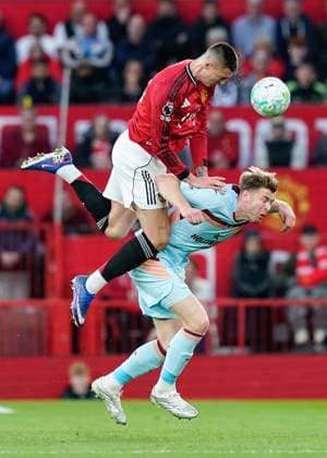 Manchester, England, 27th April 2026. Benjamin Sesko of Manchester United, ManU heads the ball while battling with Nathan Collins of Brentford during the Manchester United vs Brentford Premier League match at Old Trafford, Manchester. Picture credit should read: Andrew Yates Sportimage EDITORIAL USE ONLY. No use with unauthorised audio, video, data, fixture lists, club league logos or live services. Online in-match use limited to 120 images, no video emulation. No use in betting, games or single club league player publications. SPI_024_AY_MANCHESTER_UNITED_V_BRENTFORD SPI-4740-0024