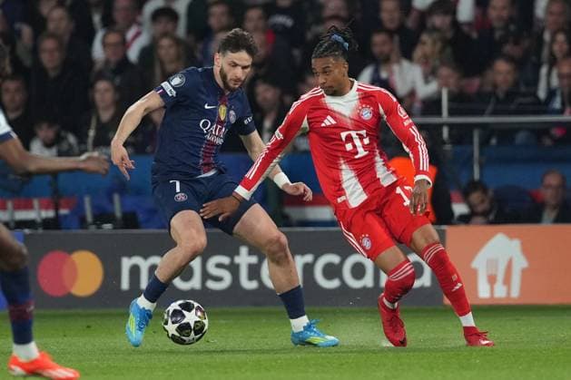 Michael Olise of Bayern Munich and Khvicha Kvaratskhelia of PSG Paris Saint-Germain v Bayern Munich, UEFA Champions League, Semi Final, First Leg, Football, Parc des Princes, Paris, France - 28 Apr 2026Paris Parc des Princes France EDITORIAL USE ONLY No use with unauthorised audio, video, data, fixture lists, club league logos or live services. Online in-match use limited to 120 images, no video emulation. No use in betting, games or single club league player publications. Copyright: xDavexWinter Shutterstockx 16847969ae