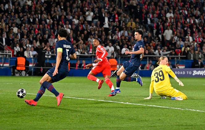 28 04 2026, Football UEFA Championsleague 2025 2026 semi-final first leg, Paris St Germain FC Bayern Munich, at Parc de Princes stadium in Paris France Michael Olise FC Bayern Munich with scoring chance against goalkeeper Matvey Safonov FC Paris Saint Germain and Marquinhos FC Paris Saint Germain DFL and DFB regulations prohibit any use of photographs as image sequences and or quasi video