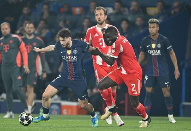 PSG v FC Bayern Munich - UEFA Champions League PARIS, FRANCE - APRIL 28: Khvicha Kvaratskhelia (L) of Paris Saint-Germain (PSG) and Dayot Upamecano (R) of FC Bayern Munich compete for the ball during the UEFA Champions League semi-final first leg match between PSG and FC Bayern Munich at Parc des Princes in Paris, France on April 28, 2026. Mustafa Yalcin Anadolu Paris France. Editorial use only. Please get in touch for any other usage.  Copyright: x2026xAnadoluxMustafaxYalcinx