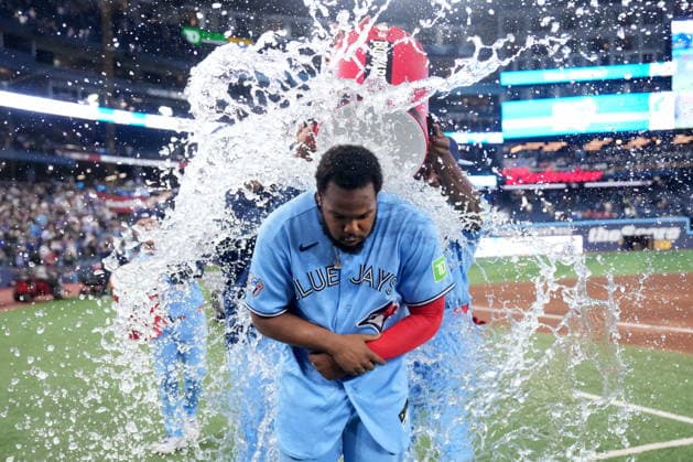 April 28, 2026, Toronto, On, CANADA: Toronto Blue Jays first baseman Vladimir Guerrero Jr. (27) gets soaked by teammates during an on-field interview following MLB, Baseball Herren, USA baseball action against the Boston Red Sox, in Toronto on Tuesday, April 28, 2026. Canada News - April 28, 2026  - ZUMAc35_ 20260428_zaf_c35_179 Copyright: xNathanxDenettex