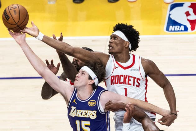 April 29, 2026, Los Angeles, California, USA: Los Angeles Lakers AUSTIN REAVES (15) and Houston Rockets AMEN THOMPSON (1) vie for a rebound during Game 5 of a first-round NBA, Basketball Herren, USA playoff series at Crypto.com Arena on Wednesday in Los Angeles. Los Angeles USA - ZUMAc68_ 20260429_zaf_c68_038 Copyright: xRingoxChiux