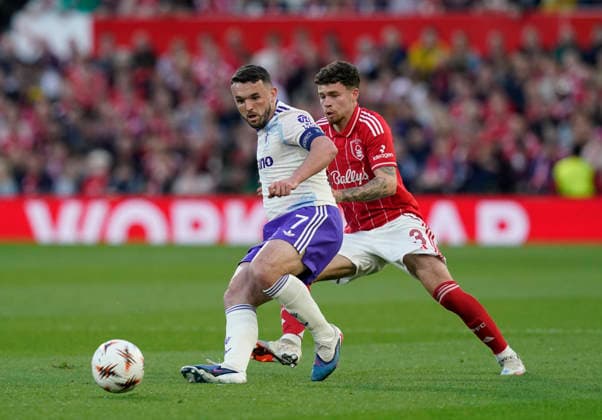Nottingham, England, 30th April 2026. Neco Williams of Nottingham Forest (r) tussles with John McGinn of Aston Villa (l) during the Nottingham Forest vs Aston Villa UEFA Europa League Semi Final 1st leg match at the City Ground, Nottingham. Picture credit should read: Andrew Yates Sportimage EDITORIAL USE ONLY. No use with unauthorised audio, video, data, fixture lists, club league logos or live services. Online in-match use limited to 120 images, no video emulation. No use in betting, games or single club league player publications. SPI_038_AY_Forest_Villa SPI-4767-0038