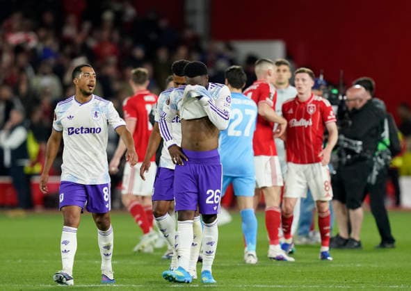 Nottingham, England, 30th April 2026. Dejected Youri Tielemans and Lamare Bogarde of Aston Villa during the Nottingham Forest vs Aston Villa UEFA Europa League Semi Final 1st leg match at the City Ground, Nottingham. Picture credit should read: Andrew Yates Sportimage EDITORIAL USE ONLY. No use with unauthorised audio, video, data, fixture lists, club league logos or live services. Online in-match use limited to 120 images, no video emulation. No use in betting, games or single club league player publications. SPI_065_AY_Forest_Villa SPI-4767-0065
