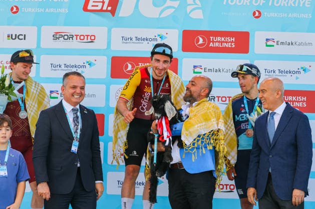 The 61st Presidential Cycling Tour of Turkiye (TUR 2026) has officially begun, starting with its opening stage in the coastal town of Cesme, Izmir. Held under the auspices of the Presidency of the Republic of Türkiye, this prestigious UCI ProSeries race brings together 23 teams and 161 world-class cyclists to compete over eight days, from April 26 to May 3, 2026...The 2026 edition unfolds across routes showcasing some of Türkiye s most striking landscapes. Starting in Cesme, the race follows the Aegean and Mediterranean coastlines, covering stages through Antalya and the southern shores before concluding in the capital, Ankara. Beyond sporting competition, the tour plays a key role in promoting Türkiye s natural and cultural richness on a global stage..This year, the race consists of 8 stages covering approximately 1,200 kilometers. Nearly 20 teams and over 150 riders from around the world are competing, under the coordination of the Turkish Cycling Federation..With the first three stages completed, the pace in the peloton has intensified and the general classification has begun to take shape. Sprint finishes and technically demanding routes have stood out, with the third stage drawing attention for its high tempo and dramatic finale..The third stage of the 61st Presidential Cycling Tour of Türkiye (TUR 2026) was won by Colombian rider Ivan Ramiro Sosa of Equipo Kern Pharma. Covering the 132.7-kilometer Marmaris-Kıran route, Sosa finished in 3 hours, 40 minutes, and 25 seconds. In the summit finish, Australian rider Sebastian Berwick of Caja Rural-Seguros RGA placed second, while French rider Nicolas Breuillard of TotalEnergies finished third..As the race progresses, challenging climbs and critical time gaps are expected to further heighten the excitement. The tour continues to deliver a compelling blend of elite competition and global vis Copyright: RizaxOzel 19081494