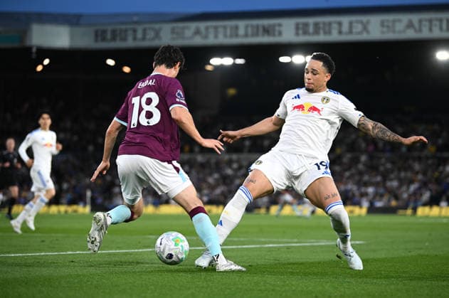Leeds, England, 1st May 2026. Noah Okafor of Leeds United lunges for the ball against Hjalmar Ekdal of Burnley during the Leeds United vs Burnley Premier League match at Elland Road, Leeds. Picture credit should read: Harriet Massey Sportimage EDITORIAL USE ONLY. No use with unauthorised audio, video, data, fixture lists, club league logos or live services. Online in-match use limited to 120 images, no video emulation. No use in betting, games or single club league player publications. SPI_053_LEEDS_v_BURNLEY SPI-4768-0053