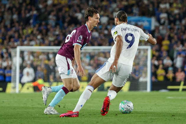 1st May 2026; Elland Road, Leeds, Yorkshire, England; Premier League Football, Leeds United versus Burnley; Hjalmar Ekdal of Burnley runs on the ball whilst under pressure from Dominic Calvert-Lewin of Leeds United AidanxHunter