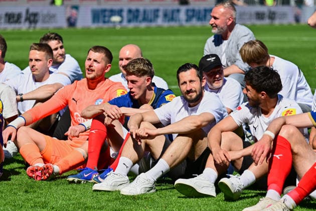 02 05 2026, Soccer, Men, 2 BL Bundesliga , Season 2025 2026, Holstein Kiel Eintracht Braunschweig, 32 Matchday Holstein Kiel celebrates relegation Alexander Bernhardsson, Steven Skrzybski right and goalkeeper Timon Weiner left Kiel, Holstein Stadion Holstein Stadion Schleswig Holstein Germany