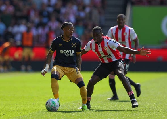 2nd May 2026; Gtech Community Stadium, Brentford, London, England; Premier League Football, Brentford versus West Ham United; Crysencio Summerville of West Ham United under pressure from Michael Kayode of Brentford JPxFletcher