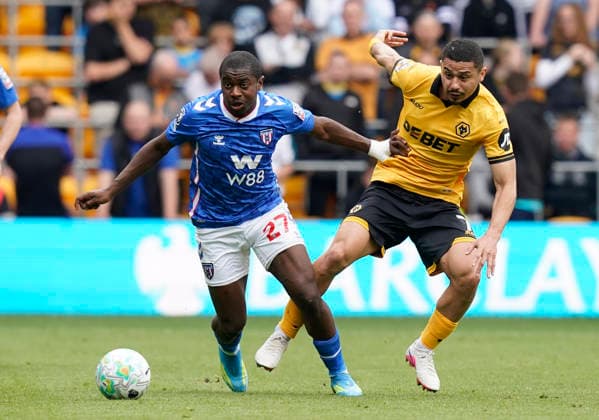 Wolverhampton, England, 2nd May 2026. Noah Sadiki of Sunderland (L) is challenged by Andre of Wolverhampton Wanderers during the Wolverhampton Wanderers vs Sunderland Premier League match at Molineux, Wolverhampton. Picture credit should read: Andrew Yates Sportimage EDITORIAL USE ONLY. No use with unauthorised audio, video, data, fixture lists, club league logos or live services. Online in-match use limited to 120 images, no video emulation. No use in betting, games or single club league player publications. SPI_023_AY_WOLVES_SUNDERLAND SPI-4772-0022