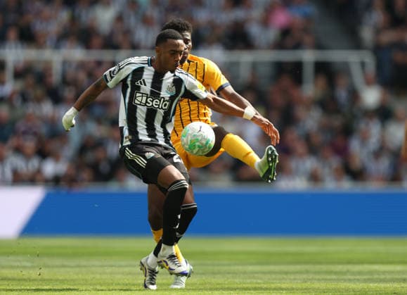 Newcastle Upon Tyne, England, 2nd May 2026. Joe Willock (L) of Newcastle United in action with Carlos Baleba of Brighton and Hove Albion during the Newcastle United vs Brighton and Hove Albion Premier League match at St. James Park, Newcastle Upon Tyne. Picture credit should read: Nigel Roddis Sportimage EDITORIAL USE ONLY. No use with unauthorised audio, video, data, fixture lists, club league logos or live services. Online in-match use limited to 120 images, no video emulation. No use in betting, games or single club league player publications. SPI_027_NR_NEWC_BRIG SPI-4784-0005