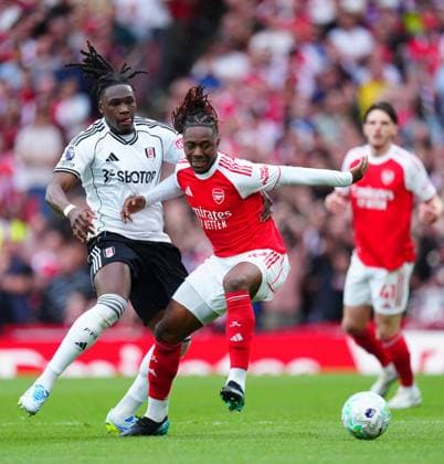 Calvin Bassey of Fulham battles with Eberechi Eze of Arsenal Arsenal v Fulham, Premier League, Football, Emirates Stadium, London , UK - 02 May 2026London Emirates Stadium United Kingdom EDITORIAL USE ONLY No use with unauthorised audio, video, data, fixture lists, club league logos or live services. Online in-match use limited to 120 images, no video emulation. No use in betting, games or single club league player publications.  Copyright: xJavierxGarcia Shutterstockx 16854566ac