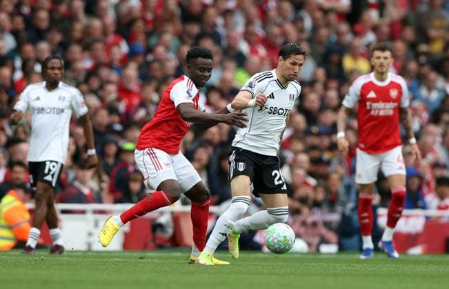 Bukayo Saka of Arsenal and Sasa Lukic of Fulham in action Arsenal v Fulham, Premier League, Football, Emirates Stadium, London , UK - 02 May 2026London Emirates Stadium United Kingdom EDITORIAL USE ONLY No use with unauthorised audio, video, data, fixture lists, club league logos or live services. Online in-match use limited to 120 images, no video emulation. No use in betting, games or single club league player publications.  Copyright: xKieranxMcManus Shutterstockx 16854568h
