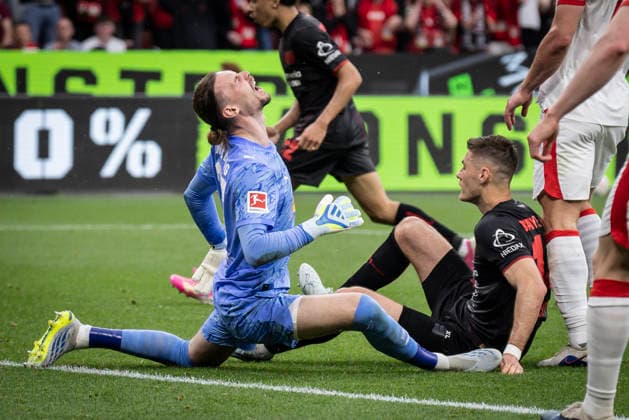 Sport Bilder des Tages LEVERKUSEN, GERMANY - MAY 2, 2026 : Keeper Maarten Vandevoordt(RB Leipzig, 26) tackled by Patrik Schick (Bayer 04 Leverkusen, 14) during the German Bundesliga match on gameday 32 between Bayer 04 Leverkusen vs. RB Leipzig at BayArena on May 2, 2026 in Leverkusen, Germany. DFL REGULATIONS PROHIBIT ANY USE OF PHOTOGRAPHS AS IMAGE SEQUENCES AND OR QUASI-VIDEO. Northrhine-Westphalia Germany Copyright: xAxelxKohringx