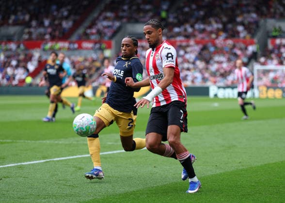 2nd May 2026; Gtech Community Stadium, Brentford, London, England; Premier League Football, Brentford versus West Ham United; Kevin Schade of Brentford under pressure from Kyle Walker-Peters of West Ham United JPxFletcher