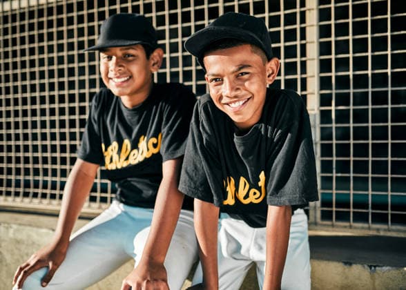 We came to play some baseball. Portrait of two young baseball players sitting together (License=RF) 19844389 ,model released, Symbolfoto  Copyright: xZoonar.com YurixArcursxpeopleimages.comx 19844389 ,model released, Symbolfoto ,property released