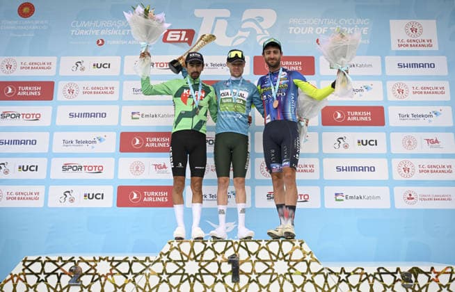 61st Presidential Cycling Tour of Turkiye ANKARA, TURKIYE - MAY 3: Australian athlete Sebastian Berwick (C) is seen on the podium after winning first place and turquoise jersey during the eighth stage of the Presidential Cycling Tour of Turkiye 2026 (TUR 2026) on the Ankara-Ankara route in Ankara, Turkiye, on May 3, 2026. The race, held for the 61st time, is included in the Union Cycliste Internationale (UCI) Europe Tour calendar and is Turkiye’s only event in the ProSeries category. The Australian cyclist Berwick also secured the turquoise jersey. Utku Ucrak Anadolu Ankara Turkey. Editorial use only. Please get in touch for any other usage.  Copyright: x2026xAnadoluxUtkuxUcrakx