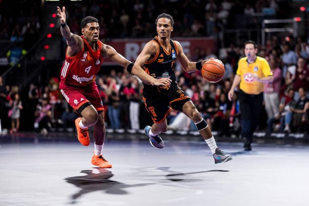 MUNICH, GERMANY - MAY 03: Alonzo Verge Jr. (Rasta Vechta, 11) controls the ball against Xavier Rathan-Mayes (FC Bayern Muenchen, 4) during the easyCredit Basketball Bundesliga match between FC Bayern Muenchen vs. Rasta Vechta at BMW Park on matchday 32 of the easyCredit Basketball Bundesliga on May 03, 2026 in Munich, Germany. Bavaria Germany Copyright: xSteffiexWunderlx