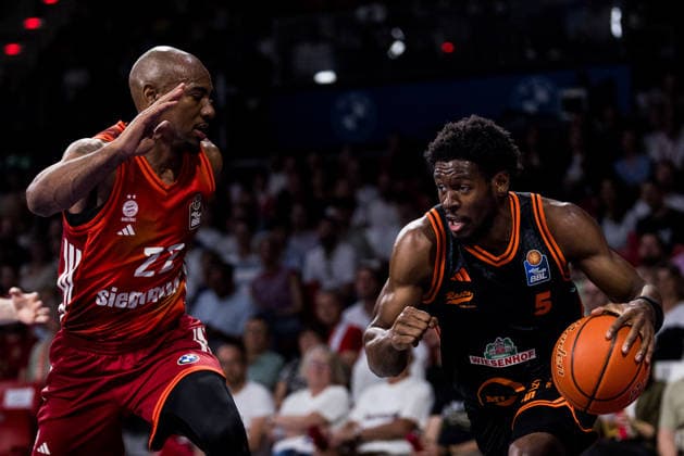MUNICH, GERMANY - MAY 03: TJ Bamba (Rasta Vechta, 5) controls the ball against Isiaha Mike (FC Bayern Muenchen, 22) during the easyCredit Basketball Bundesliga match between FC Bayern Muenchen vs. Rasta Vechta at BMW Park on matchday 32 of the easyCredit Basketball Bundesliga on May 03, 2026 in Munich, Germany. Bavaria Germany Copyright: xSteffiexWunderlx