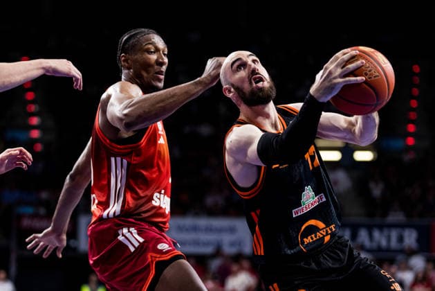 MUNICH, GERMANY - MAY 03: Tommy Kuhse (Rasta Vechta, 12) controls the ball against David McCormack (FC Bayern Muenchen, 33) during the easyCredit Basketball Bundesliga match between FC Bayern Muenchen vs. Rasta Vechta at BMW Park on matchday 32 of the easyCredit Basketball Bundesliga on May 03, 2026 in Munich, Germany. Bavaria Germany Copyright: xSteffiexWunderlx