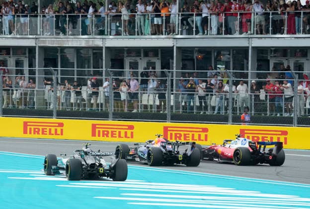 Monaco s Ferrari driver Charles Leclerc leads the pack into the first turn at the start of the Formula One Miami Grand Prix at the Miami International Autodrome in Miami Gardens, Florida on Sunday, May 3, 2026.  MIA20260503906 GREGxNASH