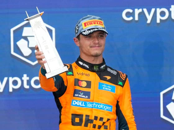 Second place finisher McLaren driver Lando Norris of Britain holds his trophy on the podium after the Formula One Miami Grand Prix at the Miami International Autodrome in Miami Gardens, Florida on Sunday, May 3, 2026. Mercedes-AMG Petronas driver Kimi Antonelli of Italy finished first and McLaren driver Oscar Piastri of Australia took third.  MIA20260503916 GREGxNASH