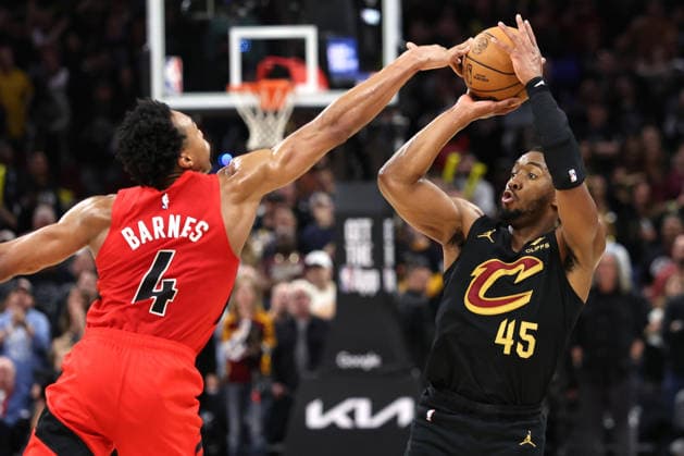 Toronto Raptors Scottie Barns (4) blocks the shot of Cleveland Cavaliers Donaovan Mitchell (45) during the fourth quarter in Cleveland, Ohio Sunday May 3, 2026. The Cavaliers defeated the Raptors 114-102 to advance to play the Detroit Pistons.  CLE20260503217 AARONxJOSEFCZYK