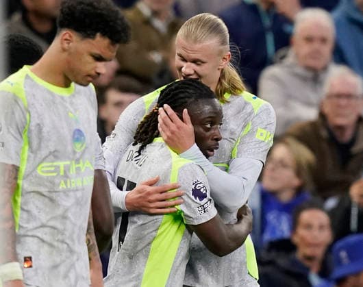 Liverpool, England, 4th May 2026. Erling Haaland of Manchester City hugs goalscorer Jeremy Doku of Manchester City during the Everton vs Manchester City Premier League match at Hill Dickinson Stadium, Liverpool. Picture credit should read: Andrew Yates Sportimage EDITORIAL USE ONLY. No use with unauthorised audio, video, data, fixture lists, club league logos or live services. Online in-match use limited to 120 images, no video emulation. No use in betting, games or single club league player publications. SPI_022_AY_Everton_Man_City SPI-4779-0022