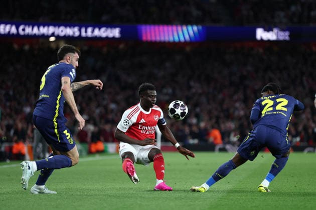 London, England, 5th May 2026. Bukayo Saka of Arsenal is challenged by Matteo Ruggeri (L) and Ademola Lookman of Atletico Madrid during the Arsenal vs Atletico Madrid UEFA Champions League match at the Emirates Stadium, London. Picture credit should read: David Klein Sportimage EDITORIAL USE ONLY. No use with unauthorised audio, video, data, fixture lists, club league logos or live services. Online in-match use limited to 120 images, no video emulation. No use in betting, games or single club league player publications. SPI_053_DK_Arsenal_Athletico_Madrid SPI-4781-0053