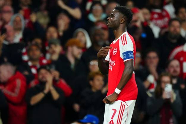 Bukayo Saka of Arsenal celebrates scoring the opening goal by pointing to his club badge Arsenal v Atletico Madrid, UEFA Champions League, Semi Final, Second Leg, Football, Emirates Stadium, London, UK - 05 May 2026London Emirates Stadium United Kingdom EDITORIAL USE ONLY No use with unauthorised audio, video, data, fixture lists, club league logos or live services. Online in-match use limited to 120 images, no video emulation. No use in betting, games or single club league player publications.  Copyright: xJavierxGarcia Shutterstockx 16859995aa