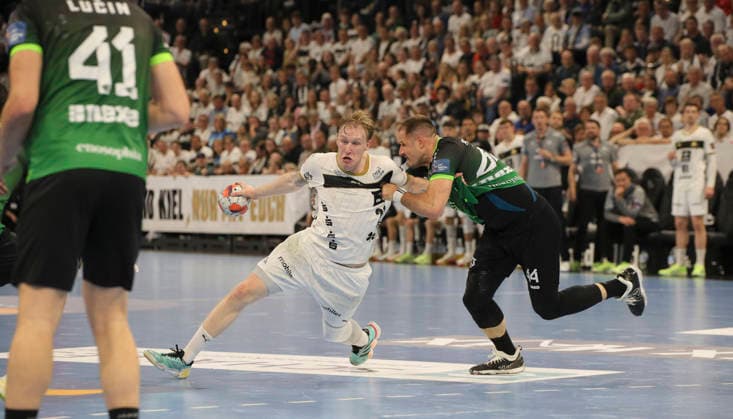 photo on the ball Eric Johansson Kiel against Kresimir Kozina Nasice , right Handball Men on Tue 05 05 2026 Mens EHF European League , THW Kiel RK Nexe Nasice