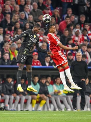 Nuno Mendes Paris Saint Germain FC and Michael Olise FC Bayern München battle for the ball during the UEFA Champions League 2025 26 Semi Final Second Leg match between FC Bayern München and Paris Saint Germain at Football Arena Munich on May 6, 2026 in Munich, Germany Photo by Harry Langer DeFodi Images