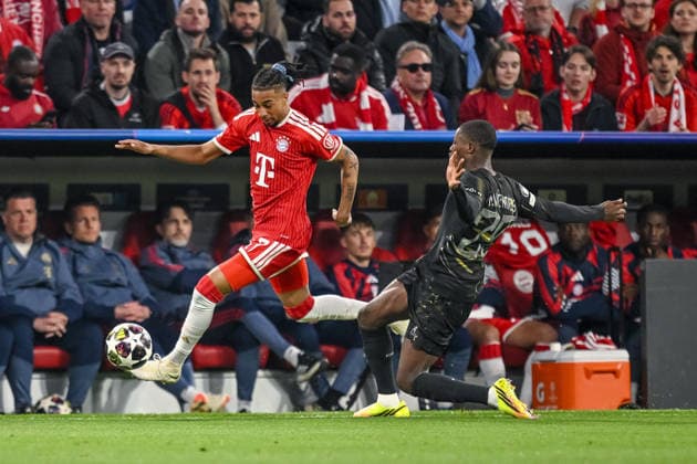 Michael Olise FC Bayern Munich and Nuno Mendes Paris Saint Germain FC battle for the ball during the UEFA Champions League 2025 26 Semi Final Second Leg match between FC Bayern Munich and Paris Saint Germain at Football Arena Munich on May 6, 2026 in Munich, Germany Photo by Harry Langer DeFodi Images