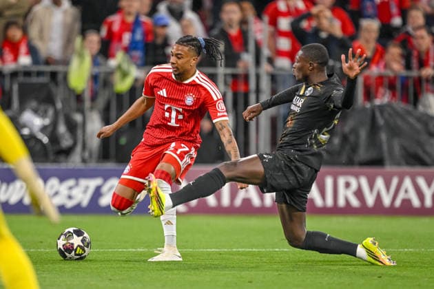 Michael Olise FC Bayern Munich and Nuno Mendes Paris Saint Germain FC battle for the ball during the UEFA Champions League 2025 26 Semi Final Second Leg match between FC Bayern Munich and Paris Saint Germain at Football Arena Munich on May 6, 2026 in Munich, Germany Photo by Harry Langer DeFodi Images