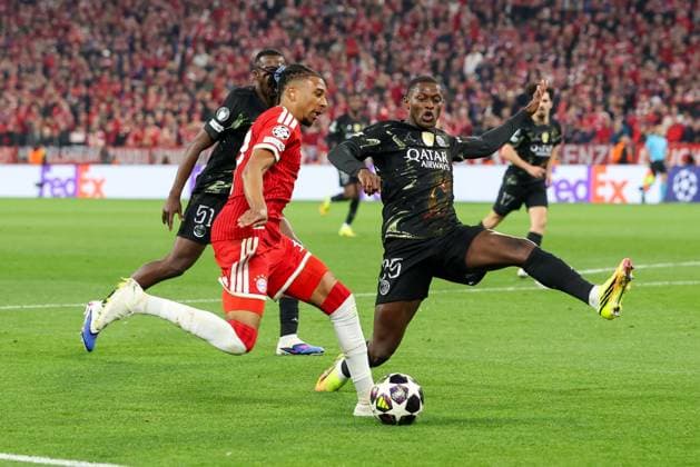 in duel, action, with Michael Olise 17 FC Bayern Muenchen , Nuno Mendes 25 Paris Saint Germain , FC Bayern Muenchen vs Paris Saint Germain, football, UEFA, Champions League, semi-final, second leg, 06 05 2026 Muenchen Bayern Germany Copyright: xkolbert-press ChristianxKolbertx