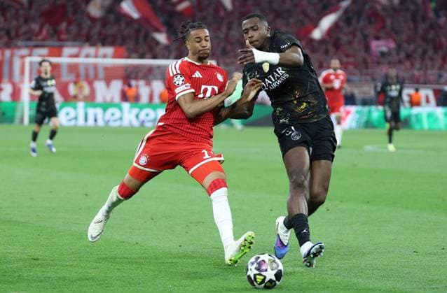 GER, CL Semi-Final FC Bayern Muenchen GER vs Paris Saint Germain FRA 06 05 2026, Allianz Arena, Munich, GER, CL Semi-Final FC Bayern Muenchen GER vs Paris Saint Germain FRA , picture shows Michael Olise FC Bayern Muenchen 17 in duel against Willian Pacho FC Paris Saint 51 nordphotoxGmbHx xSchneider nph00003