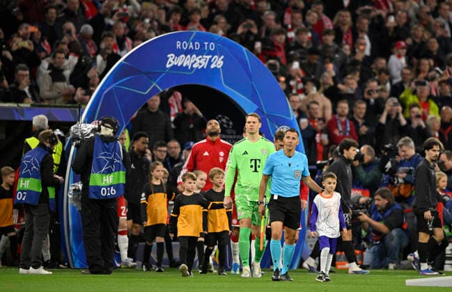 before the start of the match Referee Referee Joao Pinheiro POR and team enter the pitch with ball children through Arch ROAD TO BUDAPEST Goalkeeper Manuel Neuer FC Bayern Muenchen FCB 01 Jonathan Tah FC Bayern Muenchen FCB 04 FC Bayern Muenchen FCB vs Paris Saint Germain PSG CL Champions League semi-final second leg 06 05 2026 DFL REGULATIONS PROHIBIT ANY USE OF PHOTOGRAPHS AS IMAGE SEQUENCES AND OR QUASI VIDEO FC Bayern Muenchen FCB vs Paris Saint Germain PSG CL Champions League