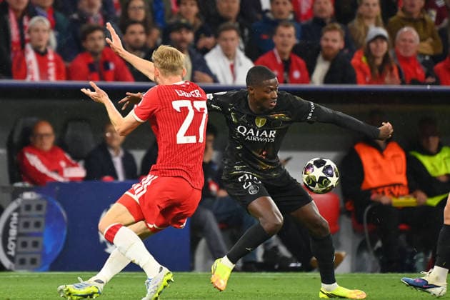 Clear handball The hand goes to the ball during the action,tackle by Konrad LAIMER Bayern Muenchen with Nuno MENDES PSG ,no penalty,penalty kick Football Champions League,season 2025 26, semi-final FC Bayern Muenchen Paris Saint Germain PSG 1 1 on 06 05 2026 A L L I A N Z A R E N A