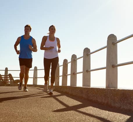 In it for the long run. a young couple jogging together the promenade (License=RF) 20136259 ,model released, Symbolfoto  Copyright: xZoonar.com KasperxRavlox 20136259 ,model released, Symbolfoto ,property released