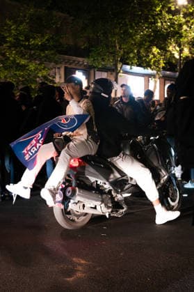 Paris Saint-Germain Qualify For The Final, Fans Celebrate In Paris Two Paris Saint-Germain supporters ride through the streets of Paris, France, on May 6, 2023, on a scooter, with one holding a PSG flag. Celebrations continue after the club s qualification for the UEFA Champions League final following their semifinal victory over Bayern Munich. paris France  Copyright: xGiuliaxMoricix originalFilename:morici-notitle260507_npXWu.jpg