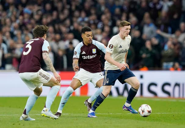 Birmingham, England, 7th May 2026. Elliot Anderson of Nottingham Forest (r) holds off Morgan Rogers of Aston Villa during the Aston Villa vs Nottingham Forest UEFA Europa League semi final match 2nd leg match at Villa Park, Birmingham. Picture credit should read: Andrew Yates Sportimage EDITORIAL USE ONLY. No use with unauthorised audio, video, data, fixture lists, club league logos or live services. Online in-match use limited to 120 images, no video emulation. No use in betting, games or single club league player publications. SPI_046_AY_Villa_Forest SPI-4782-0044