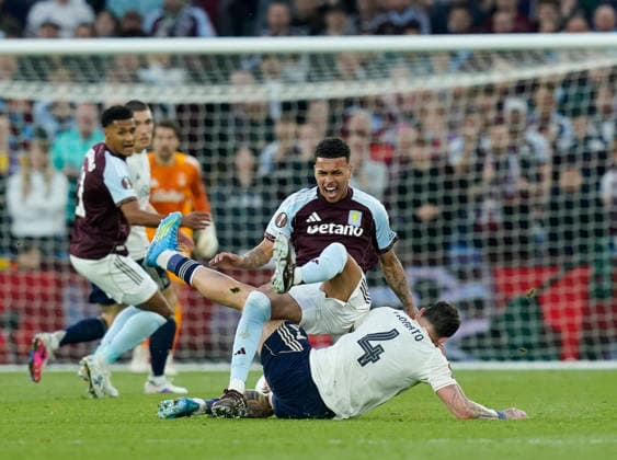 Birmingham, England, 7th May 2026. Morato of Nottingham Forest fouls Morgan Rogers of Aston Villa during the Aston Villa vs Nottingham Forest UEFA Europa League semi final match 2nd leg match at Villa Park, Birmingham. Picture credit should read: Andrew Yates Sportimage EDITORIAL USE ONLY. No use with unauthorised audio, video, data, fixture lists, club league logos or live services. Online in-match use limited to 120 images, no video emulation. No use in betting, games or single club league player publications. SPI_047_AY_Villa_Forest SPI-4782-0047